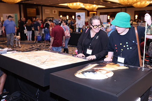 Federationists visit the 3DPhotoWorks booth in the Exhibit Hall.